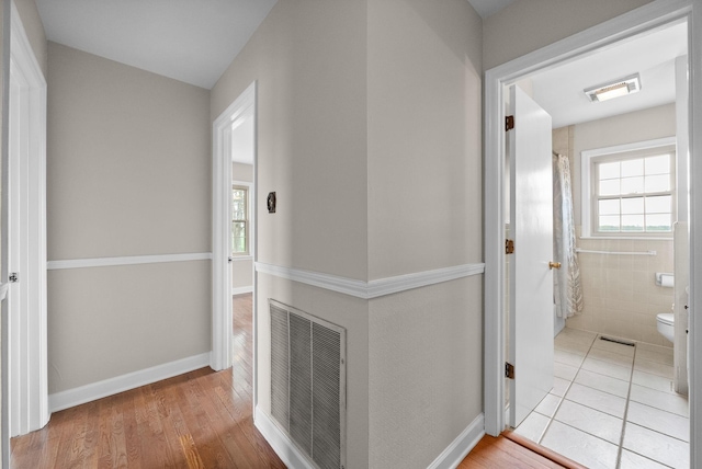 13391 Fruit Hill Red Bridge Rd, Crofton, KY 42217 - hallway featuring plenty of natural light, wood finished floors, and visible vents
