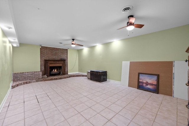 13391 Fruit Hill Red Bridge Rd, Crofton, KY 42217 - unfurnished living room with a ceiling fan, a brick fireplace, tile patterned floors, and visible vents