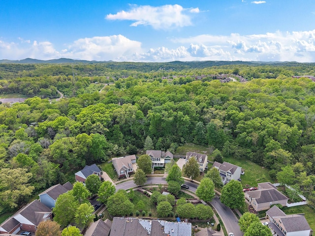 aerial view with a residential view and a view of trees