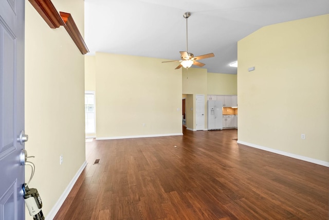 unfurnished living room featuring high vaulted ceiling, ceiling fan, baseboards, and wood finished floors