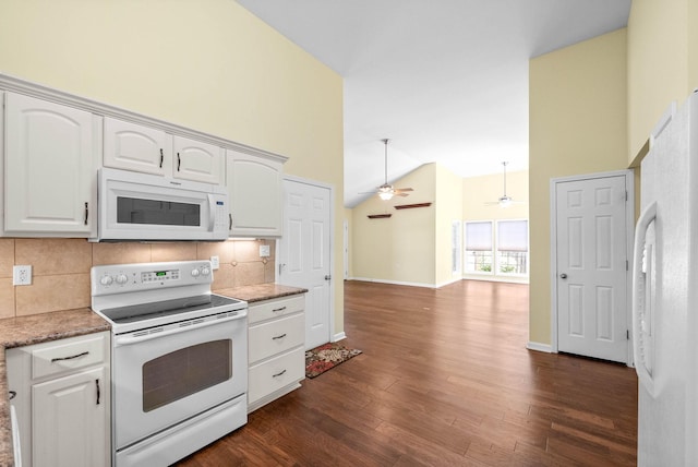 kitchen featuring tasteful backsplash, white cabinetry, a ceiling fan, white appliances, and dark wood-type flooring