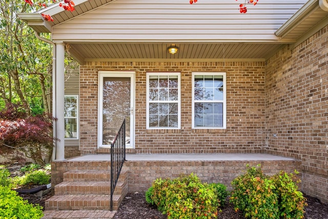 entrance to property with brick siding
