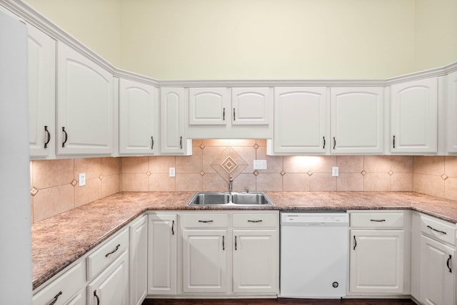 kitchen featuring white cabinets, dishwasher, decorative backsplash, and a sink