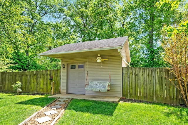 view of outbuilding featuring a fenced backyard