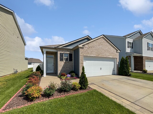 7007 Berkswell Dr, Lebanon, TN 37087 - view of front of house featuring concrete driveway, a front lawn, brick siding, and a garage