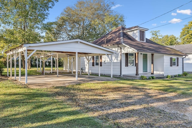 111 3rd Ave, Mount Pleasant, TN 38474 - bungalow-style home with a detached carport, a shingled roof, a porch, and a front yard