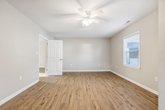 111 3rd Ave, Mount Pleasant, TN 38474 - spare room featuring visible vents, baseboards, light wood-style floors, and ceiling fan