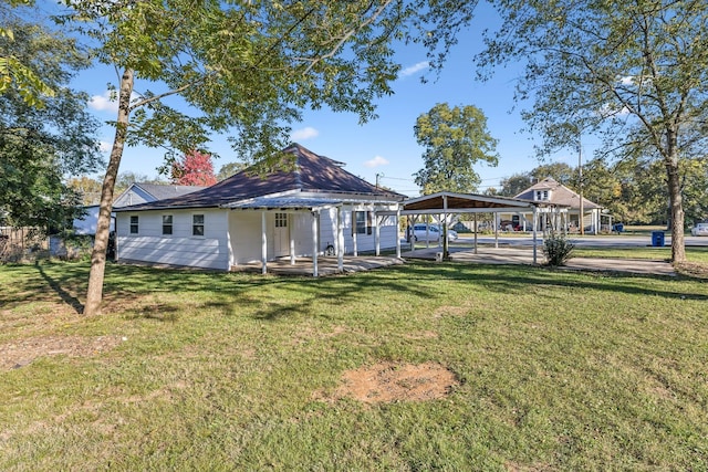 111 3rd Ave, Mount Pleasant, TN 38474 - rear view of property featuring a lawn and a detached carport