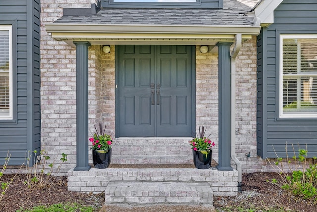 entrance to property with brick siding