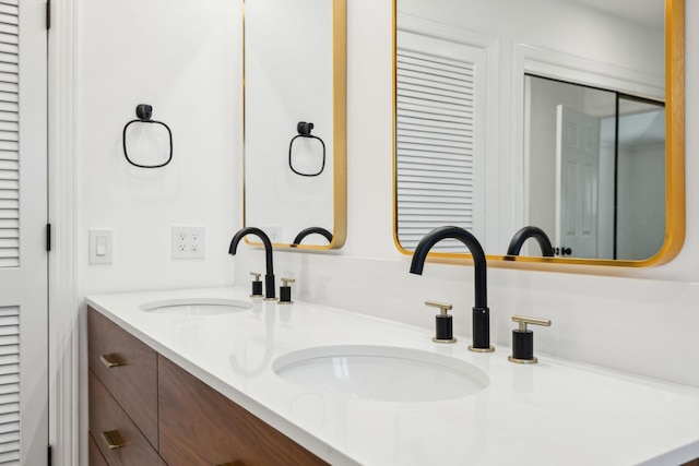 bathroom featuring double vanity and a sink