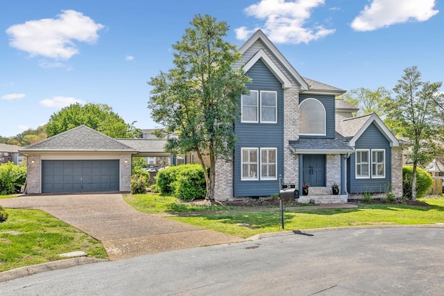 traditional home featuring a front lawn, a garage, brick siding, driveway, and roof with shingles