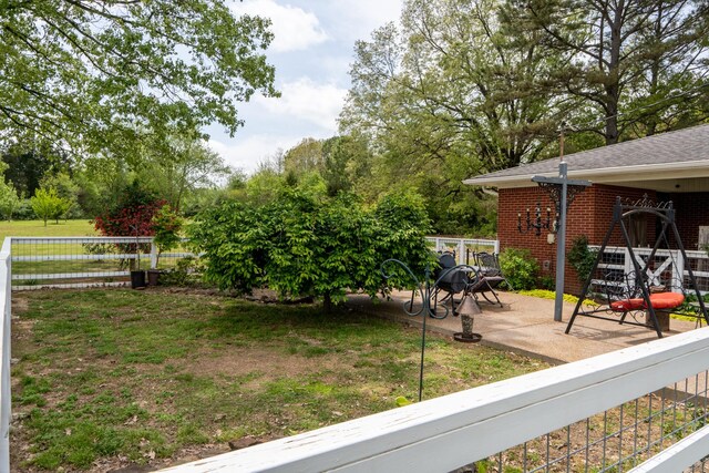 60 Sam Johnson Ln, Scotts Hill, TN 38374 - view of yard with fence and a patio