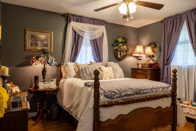 60 Sam Johnson Ln, Scotts Hill, TN 38374 - bedroom with ceiling fan and wood finished floors