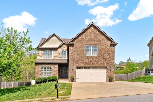 3152 Timberdale Dr, Clarksville, TN 37042 - view of front of property featuring concrete driveway, an attached garage, brick siding, and central AC unit