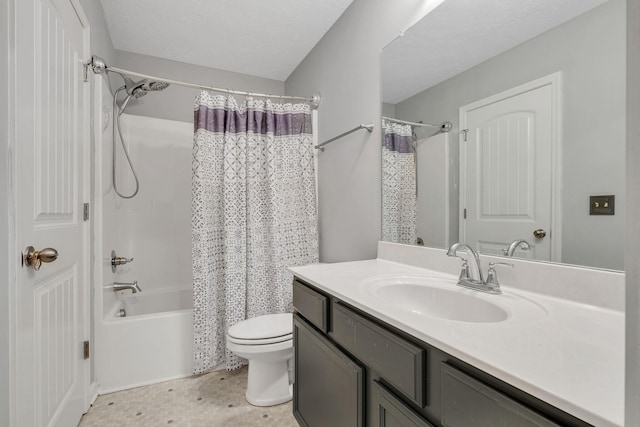 bathroom featuring shower / tub combo, toilet, and vanity