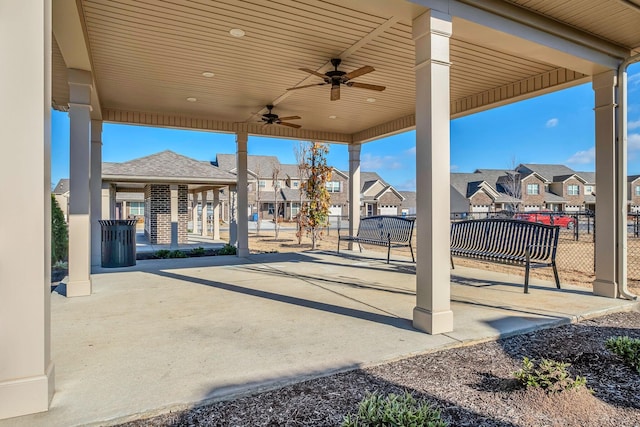 view of patio / terrace with a residential view, a ceiling fan, and fence