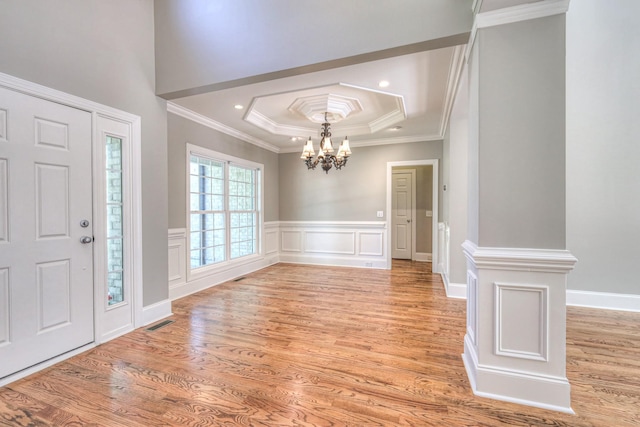 1178 Mccoury Ln, Spring Hill, TN 37174 - foyer with a notable chandelier, a raised ceiling, light wood-style floors, visible vents, and ornamental molding