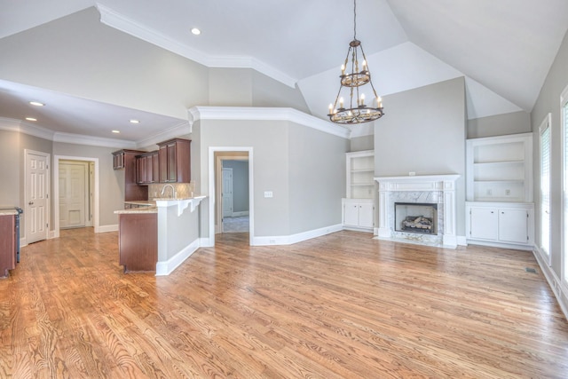 1178 Mccoury Ln, Spring Hill, TN 37174 - unfurnished living room featuring recessed lighting, high vaulted ceiling, light wood finished floors, and a chandelier