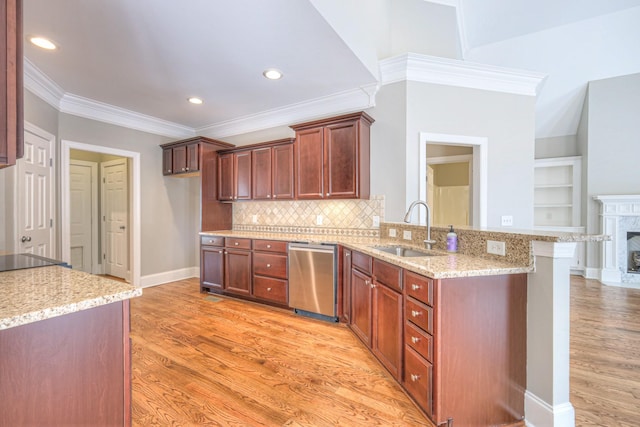 1178 Mccoury Ln, Spring Hill, TN 37174 - kitchen featuring a sink, light wood finished floors, a peninsula, stainless steel dishwasher, and ornamental molding