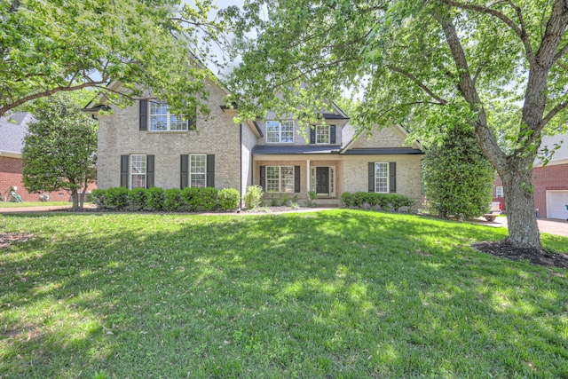 1178 Mccoury Ln, Spring Hill, TN 37174 - traditional home featuring a front lawn and brick siding