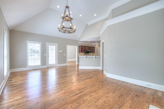 1178 Mccoury Ln, Spring Hill, TN 37174 - unfurnished living room featuring light wood-style floors, high vaulted ceiling, a chandelier, recessed lighting, and baseboards