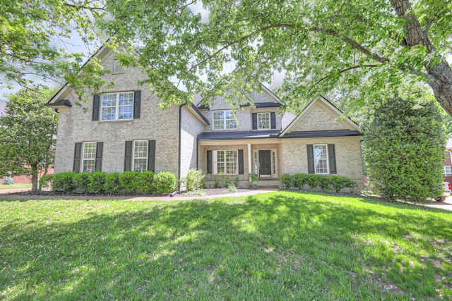 1178 Mccoury Ln, Spring Hill, TN 37174 - traditional-style home featuring brick siding and a front lawn