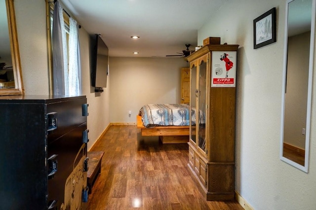 bedroom with recessed lighting, baseboards, and dark wood-style floors