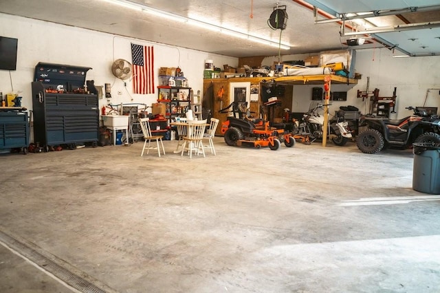 garage featuring a workshop area and a garage door opener