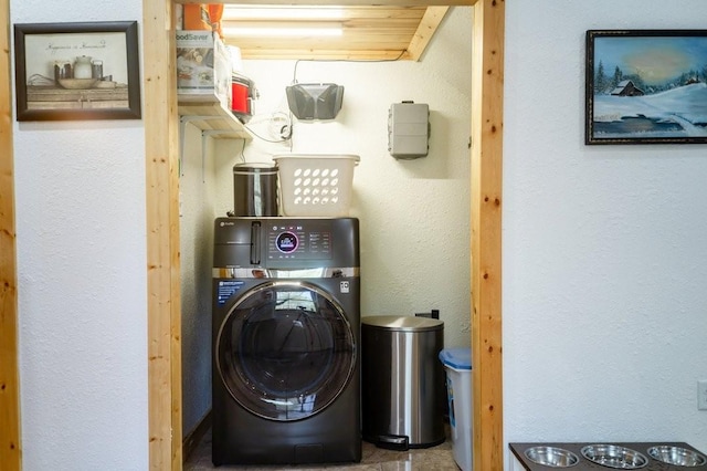 clothes washing area with laundry area and washer / clothes dryer