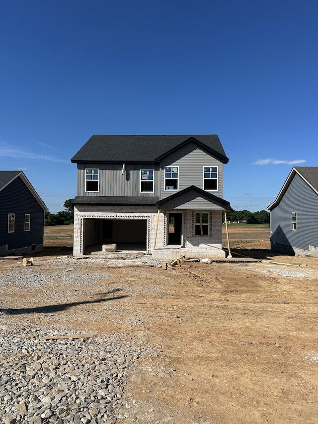 6 Hugh Hunter Rd, Oak Grove, KY 42262 - view of front of house featuring a garage, covered porch, and a shingled roof