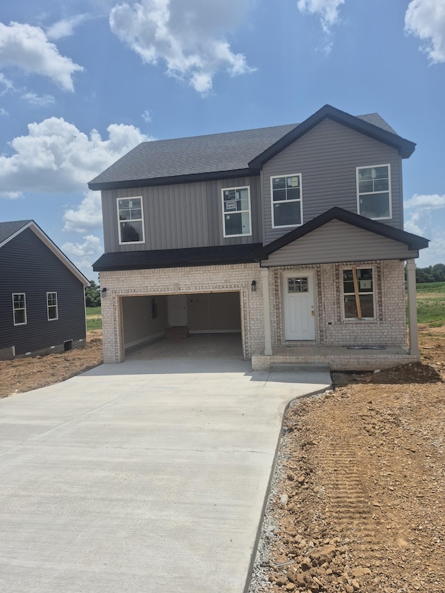 6 Hugh Hunter Rd, Oak Grove, KY 42262 - view of front of home with brick siding, driveway, an attached garage, and roof with shingles