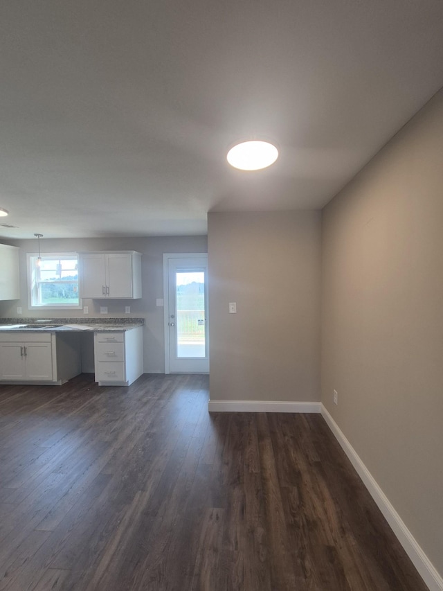 6 Hugh Hunter Rd, Oak Grove, KY 42262 - kitchen with white cabinetry, dark wood-style floors, light countertops, and hanging light fixtures