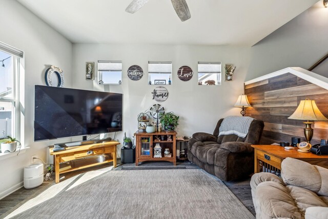 living room with plenty of natural light and wood finished floors