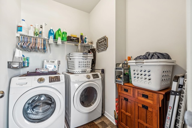 laundry room with separate washer and dryer and laundry area