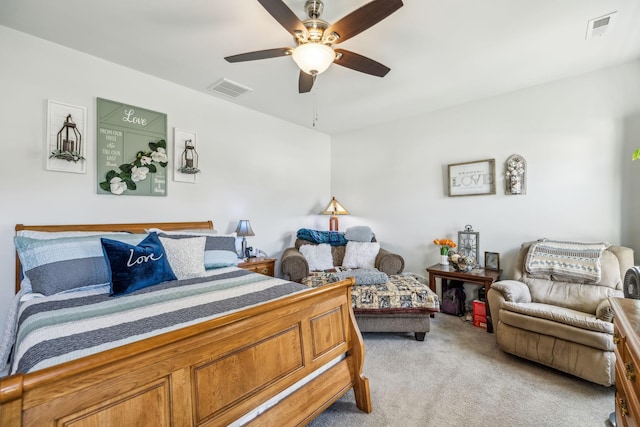 bedroom featuring light colored carpet, ceiling fan, and visible vents