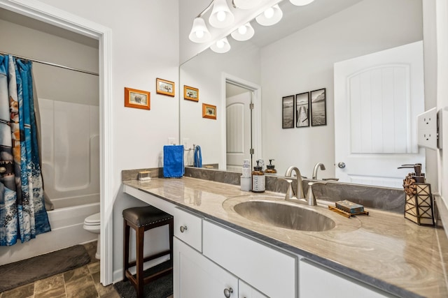 bathroom with toilet, vanity, and shower / bath combination with curtain