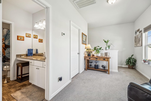 interior space featuring carpet floors and visible vents