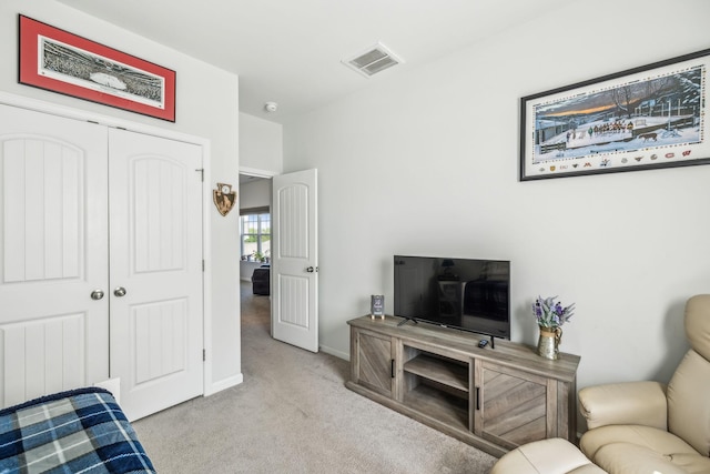 living room with baseboards, carpet flooring, and visible vents