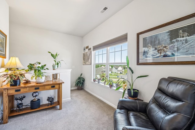 sitting room featuring carpet, visible vents, and baseboards