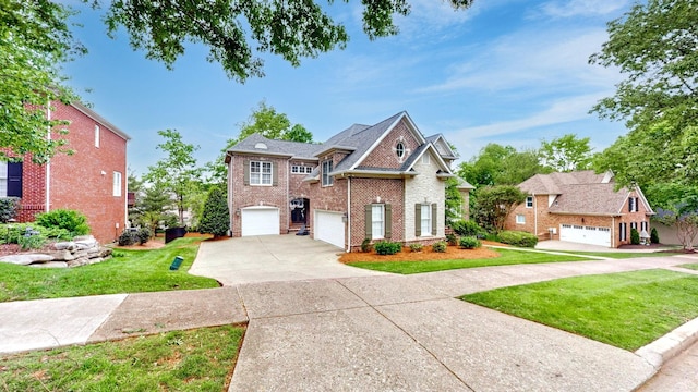 146 Allenhurst Cir, Franklin, TN 37067 - view of front of house with brick siding, a garage, a front lawn, and concrete driveway