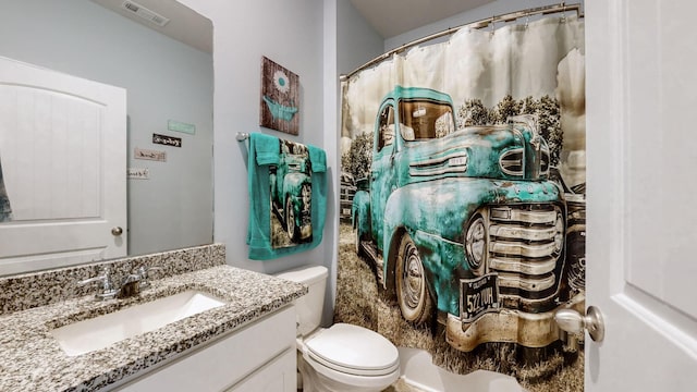 full bath with toilet and vanity