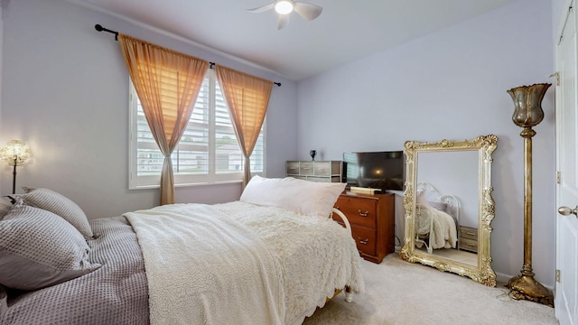 bedroom featuring light carpet and ceiling fan