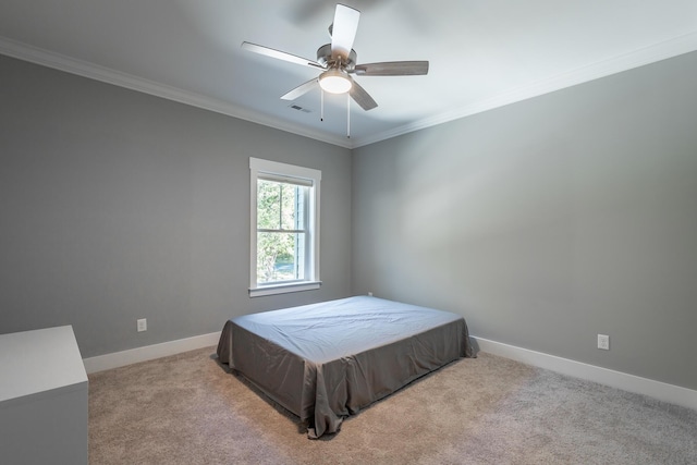 bedroom with visible vents, baseboards, carpet, and ornamental molding