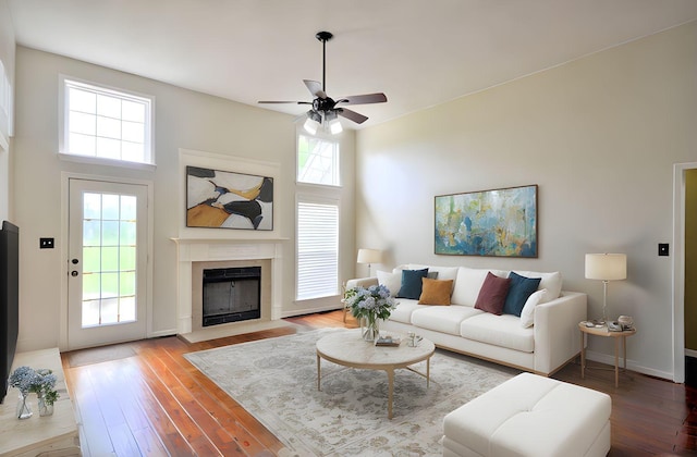 4434 Monticello Trce, Adams, TN 37010 - living area with a ceiling fan, hardwood / wood-style flooring, and a fireplace with flush hearth