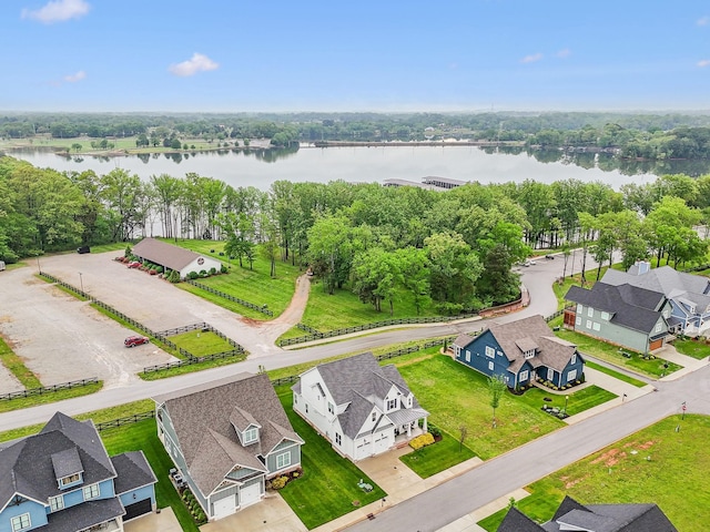 bird's eye view with a residential view and a water view