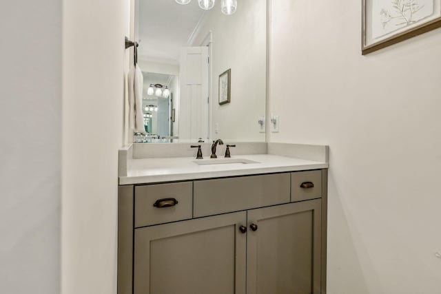 bathroom featuring ornamental molding and vanity