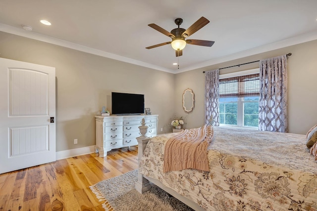 bedroom with recessed lighting, a ceiling fan, light wood-type flooring, crown molding, and baseboards