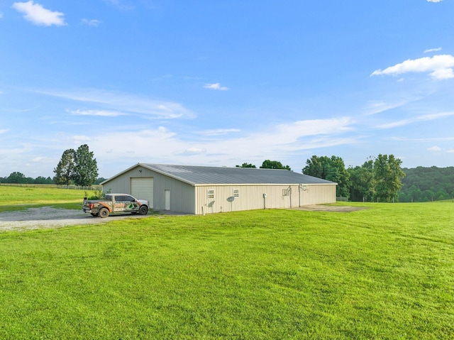 exterior space featuring an outbuilding, a detached garage, and a pole building