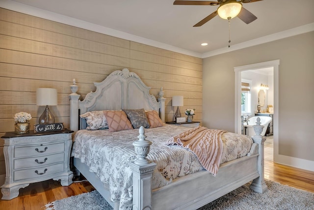 bedroom featuring recessed lighting, wood walls, wood finished floors, a ceiling fan, and crown molding