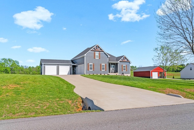 view of front of property with driveway, board and batten siding, and a front yard